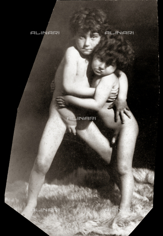 Fulllength portrait of two children nude embracing